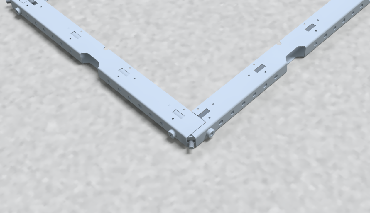 Two u-profiles forming a corner piece on a gray textured surface.