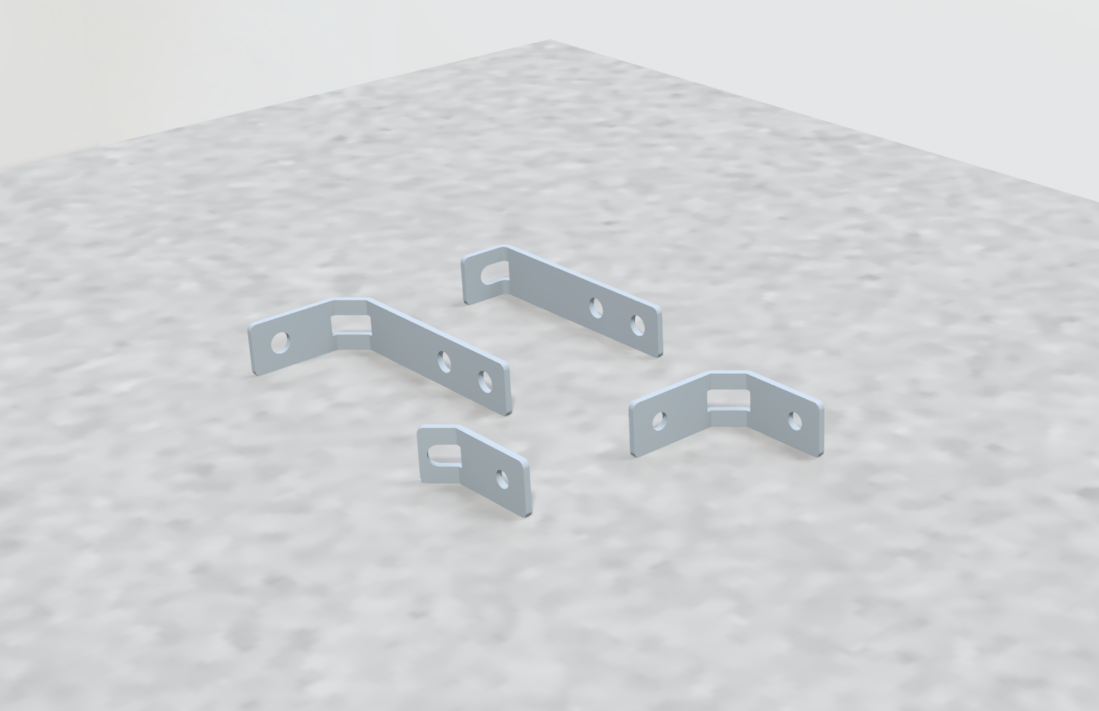 Four small metal brackets with holes for screws on a gray textured surface.