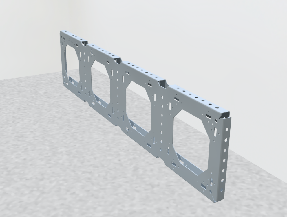 A metal frame with four cut-out sections, likely a structural component or part of machinery, placed on a gray textured surface against a white background.