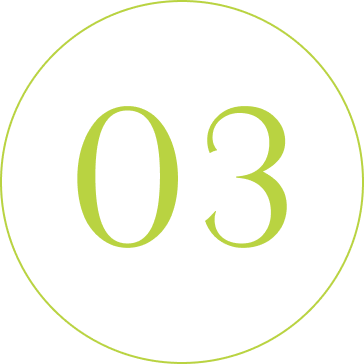 A black and green circular sign displaying the number '03' in the center.