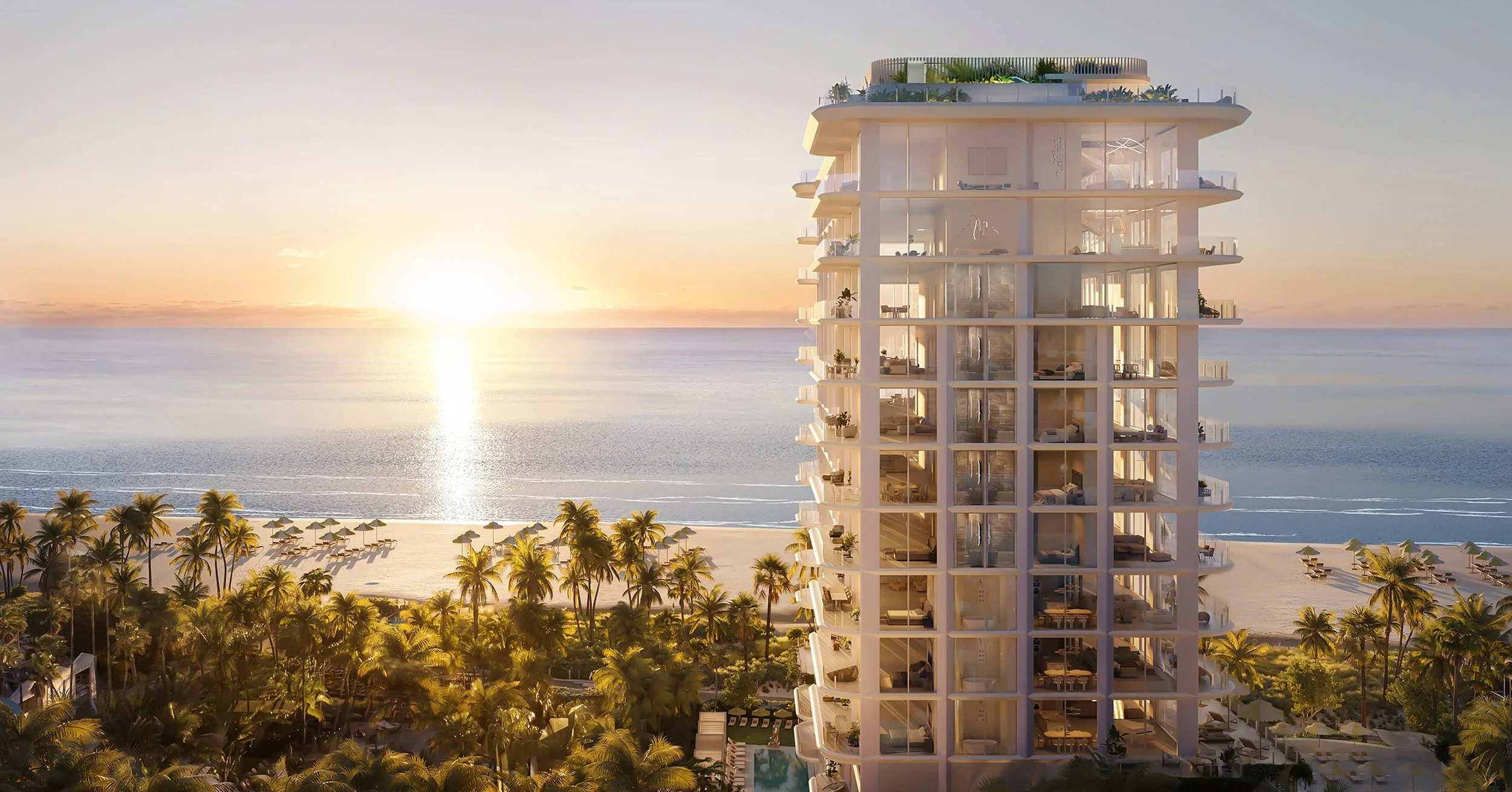 A modern beachfront high-rise hotel with glass balconies, overlooking a sandy beach lined with palm trees and sun umbrellas, with the sun setting over the ocean.