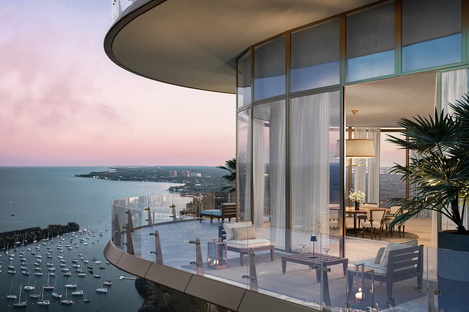 Modern high-rise apartment with a glass balcony overlooking a harbor with boats, ocean, and distant land at sunset