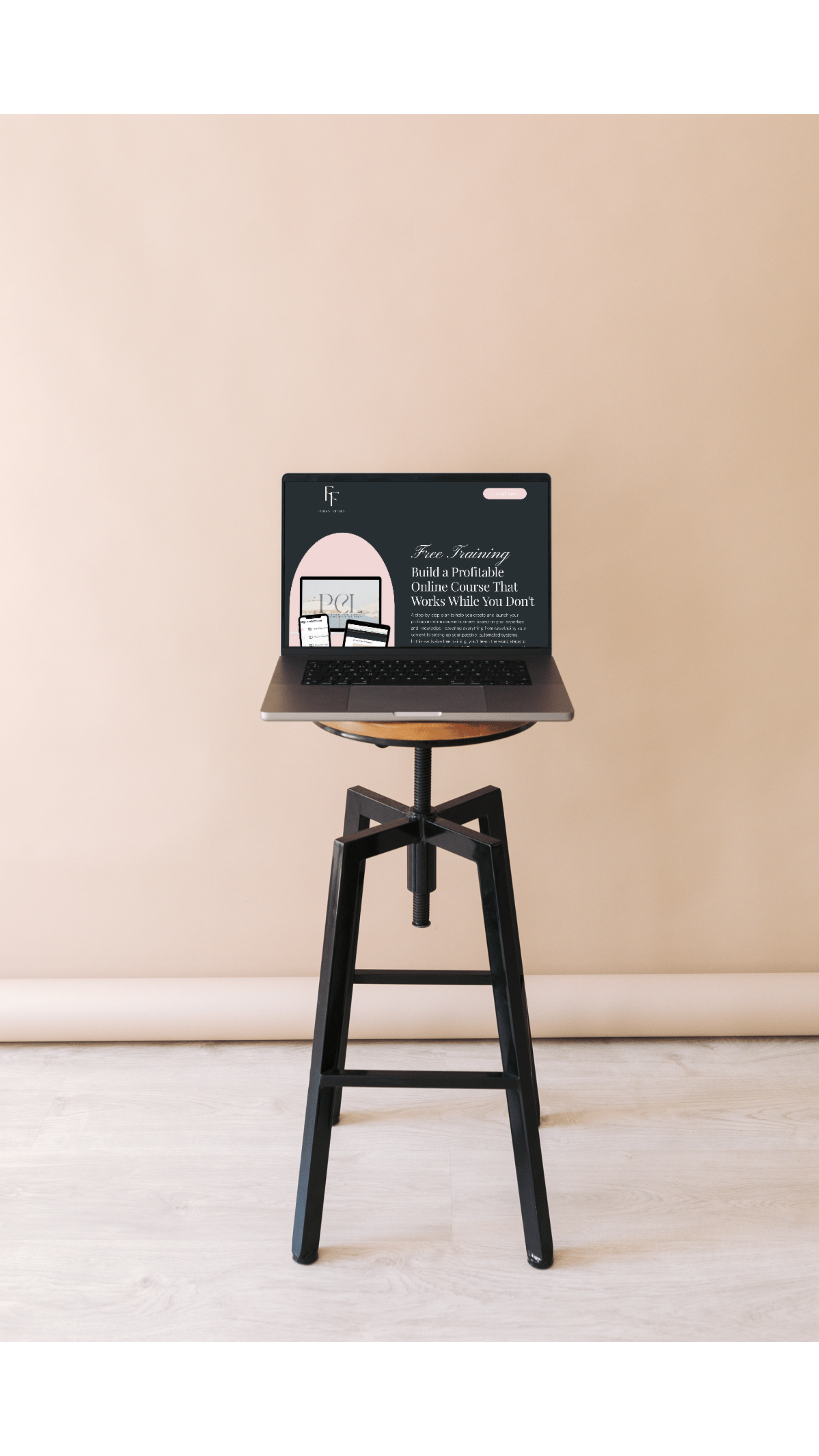 Laptop on a wooden stand, displaying a webpage for free online training courses, against a plain beige wall.