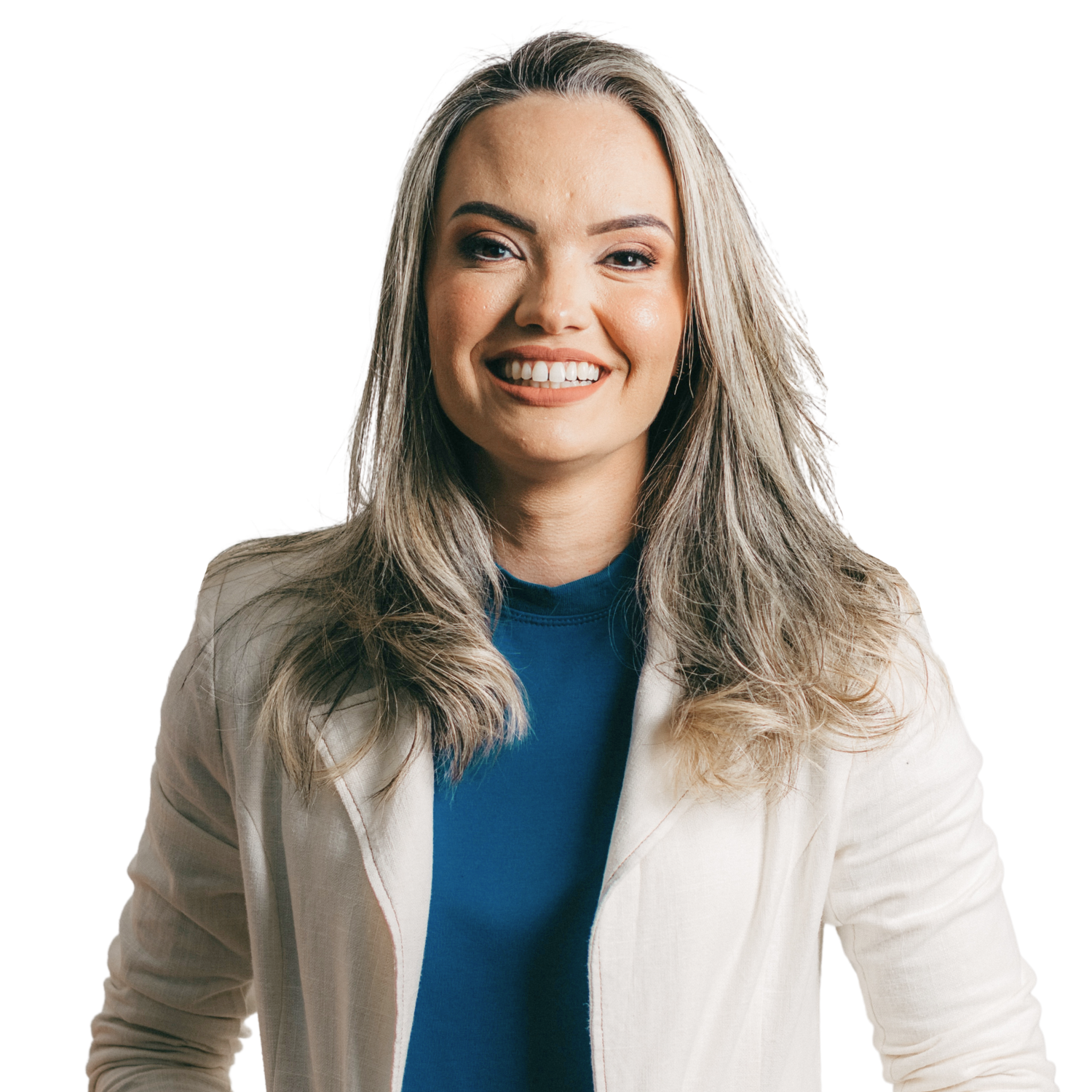 A woman with long, wavy blonde hair wearing a white blazer over a blue top, smiling confidently.