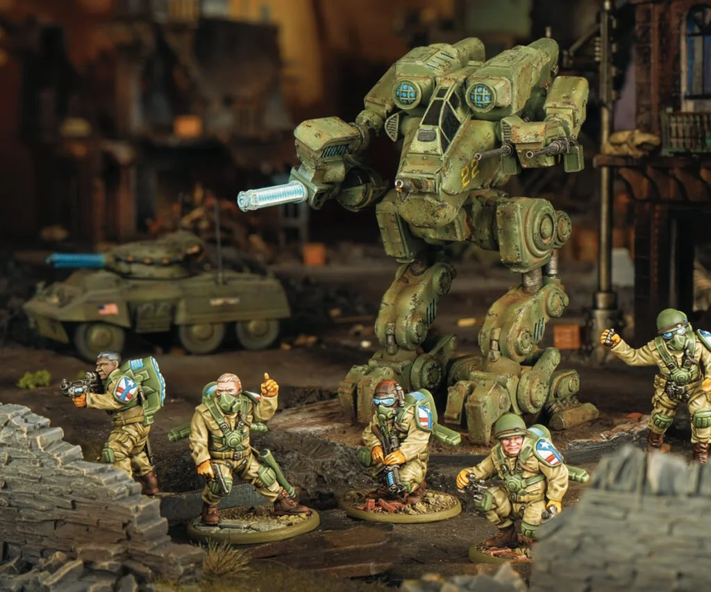 Miniature detailed diorama depicting a military scene with soldiers, a large mech robot, and a tank in a war-torn urban environment.