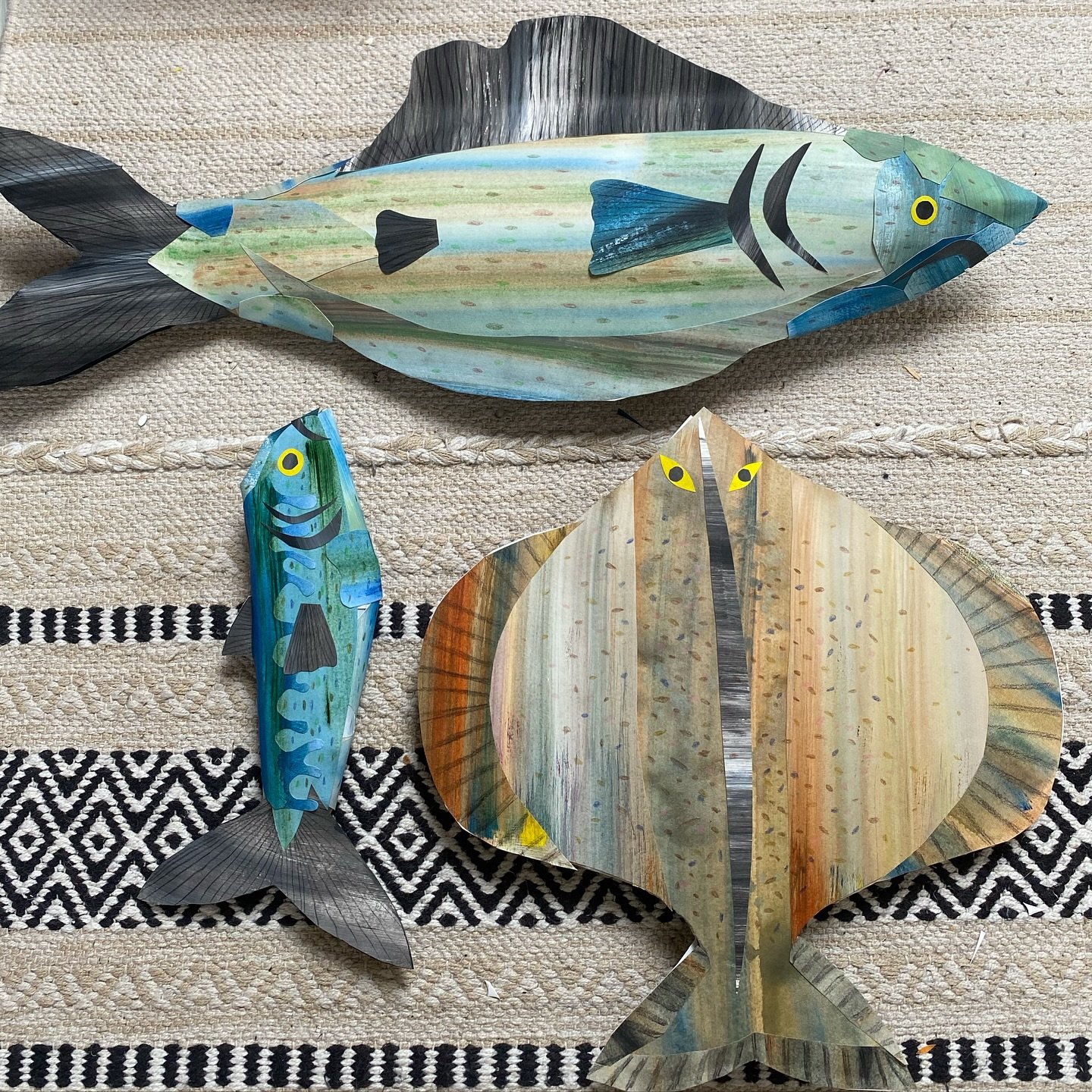 Three paper fish (not seaworthy)

Made from old cardboard packaging
