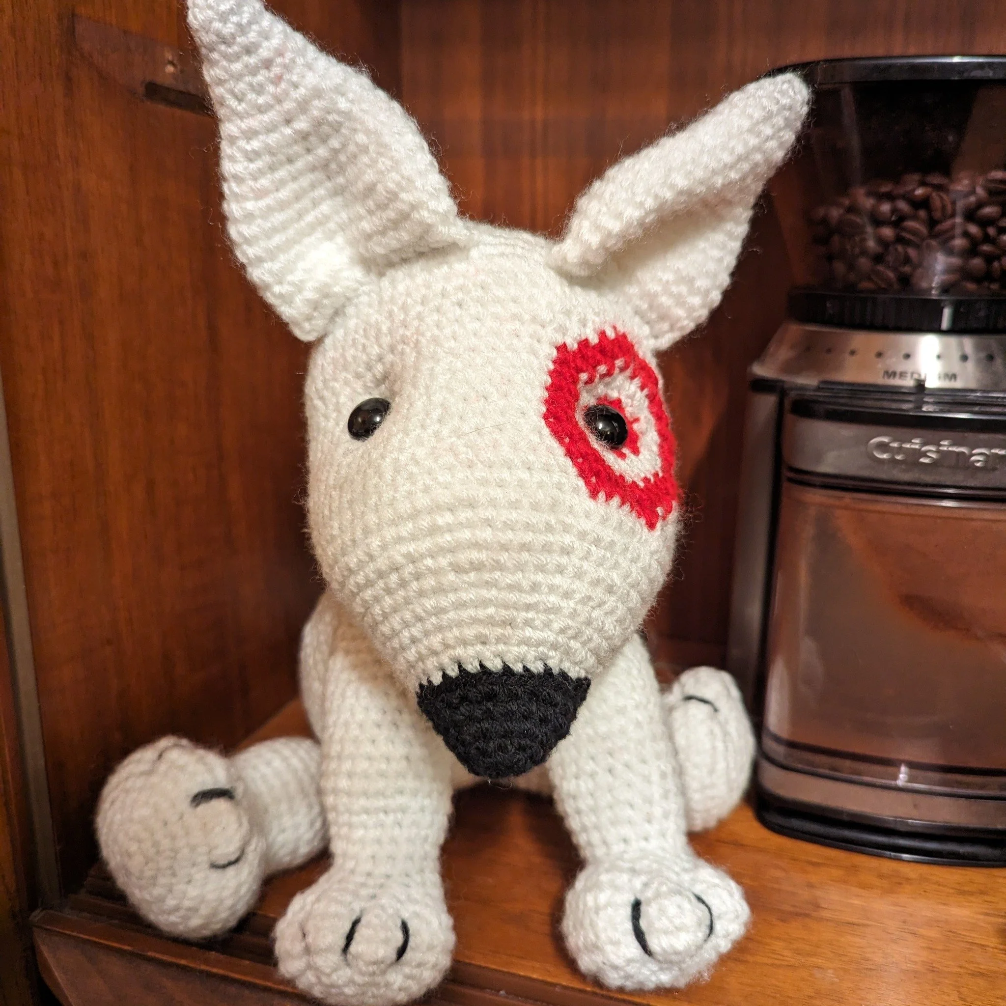My husband works at target and had no target swag at his desk, so I made him this little guy and left it by his coffee! #targetdog #crochet