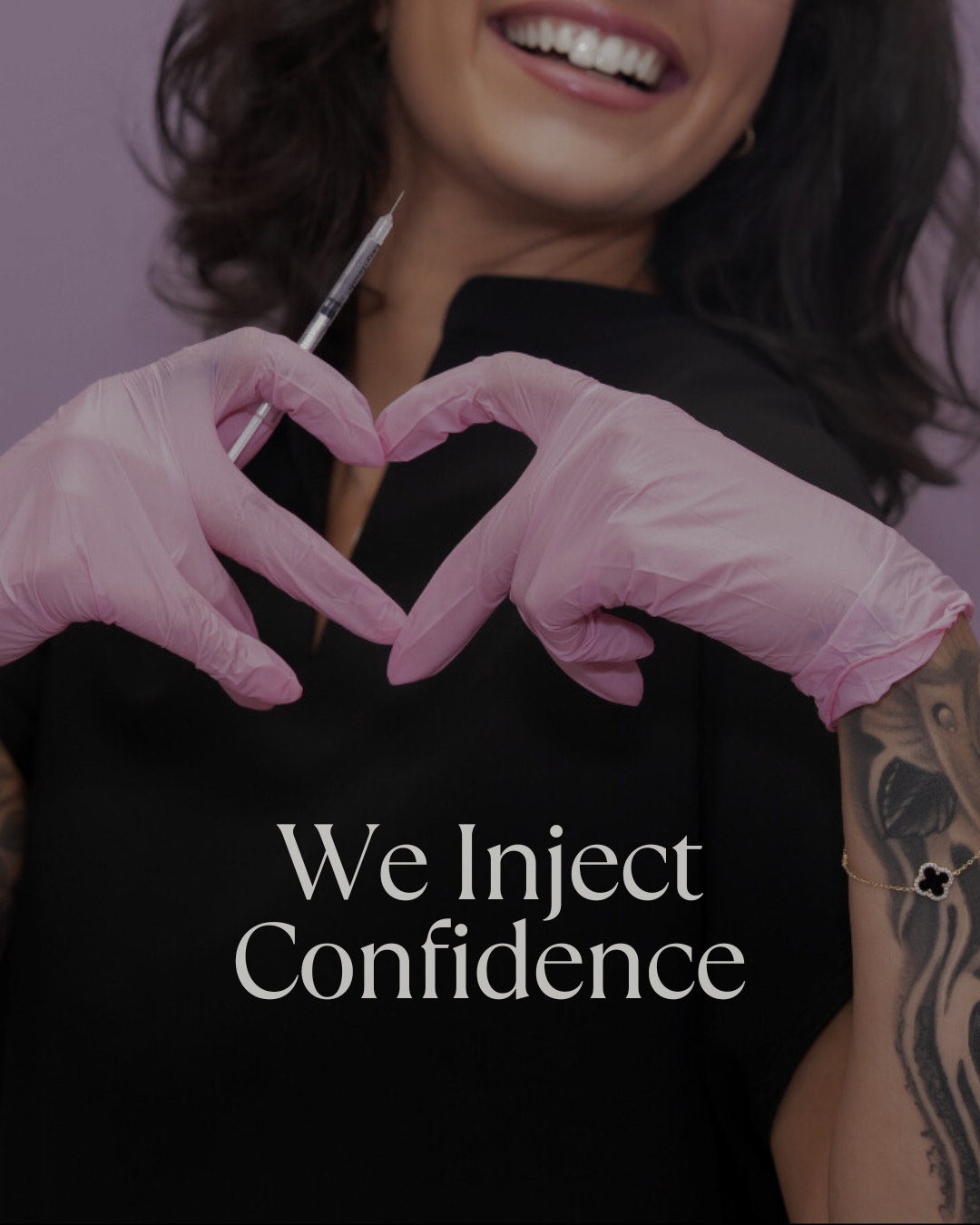A woman smiling and forming a heart shape with her hands, wearing pink gloves and holding a syringe, with text overlay saying 'We Inject Confidence'.