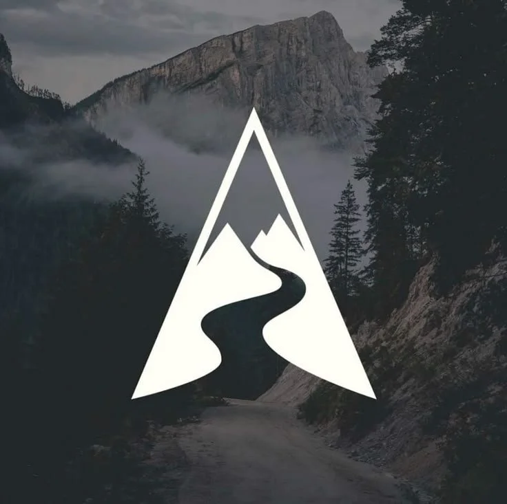 A mountain landscape with a winding river, surrounded by trees, with cloudy skies, overlaid by a white geometric logo depicting mountains and a river in a triangular shape.