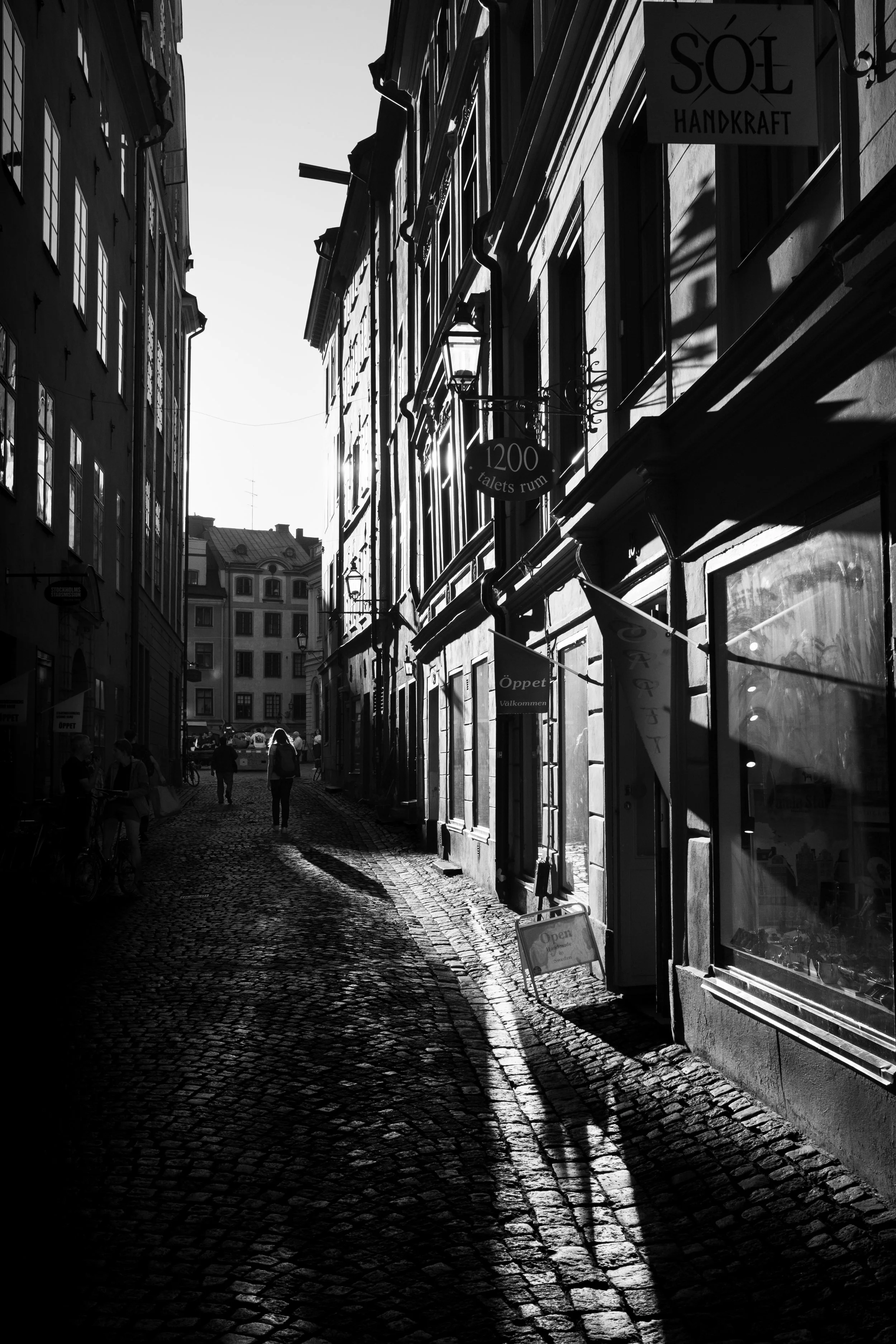 Cobblestones, long shadows, and the hum of a timeless street.