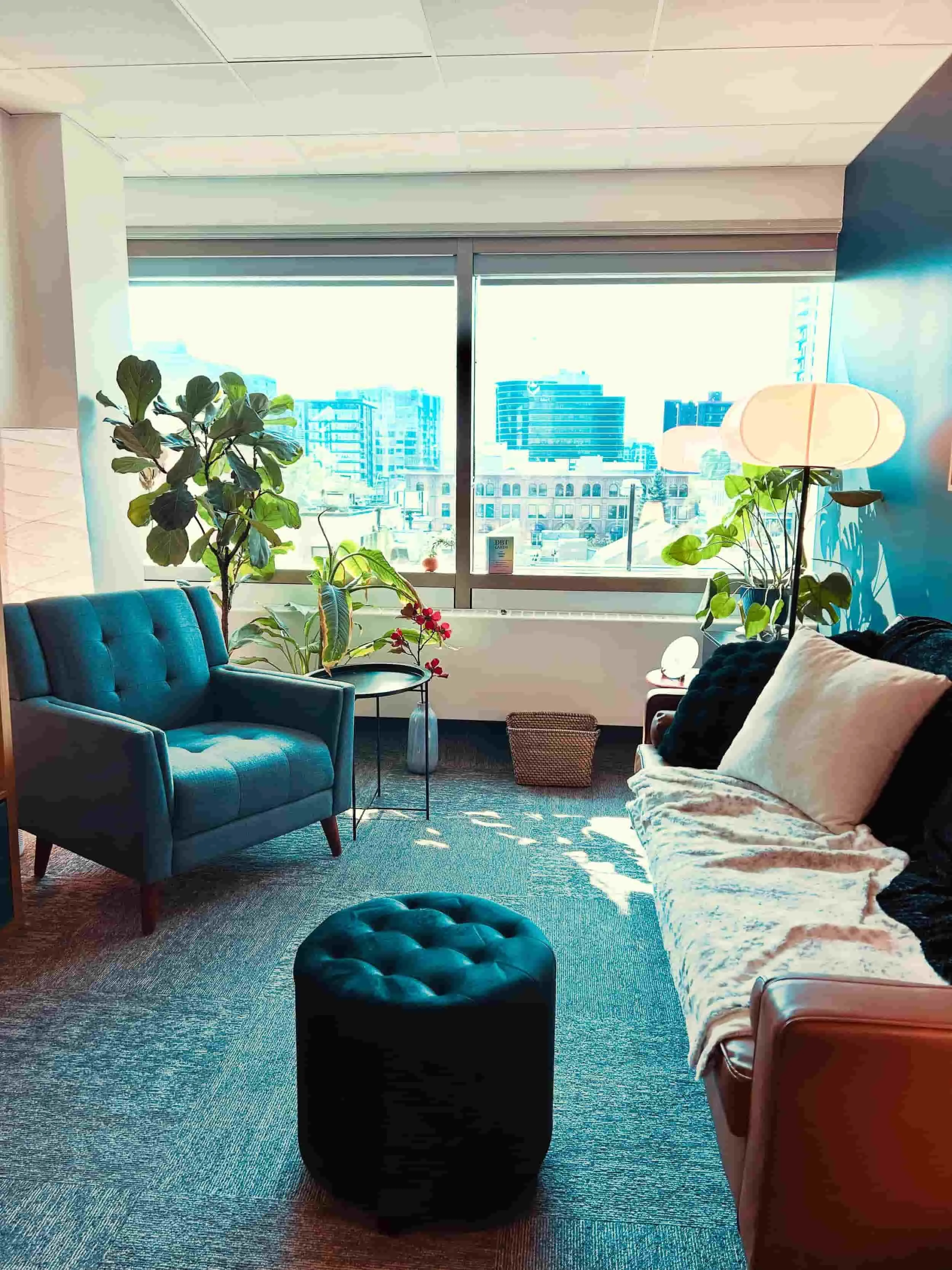 The backdrop of the skyline of Edmonton with beautiful nature in Samantha Greenwood's office. - psychologist-for-healthcare-workers-edmonton therapy-for-high-achieving-professionals-edmonton
