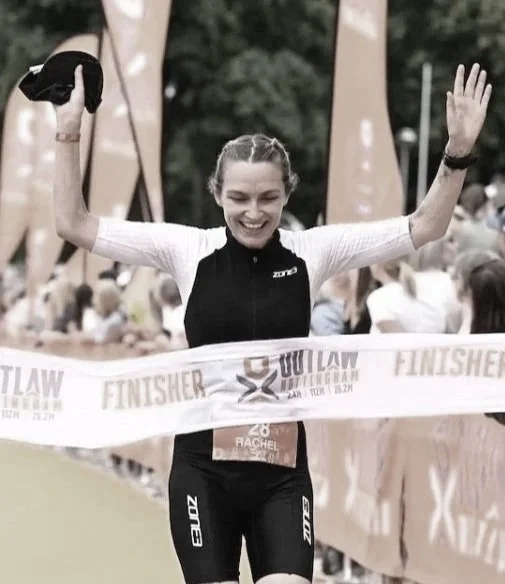 Triathlete smiling at finish line