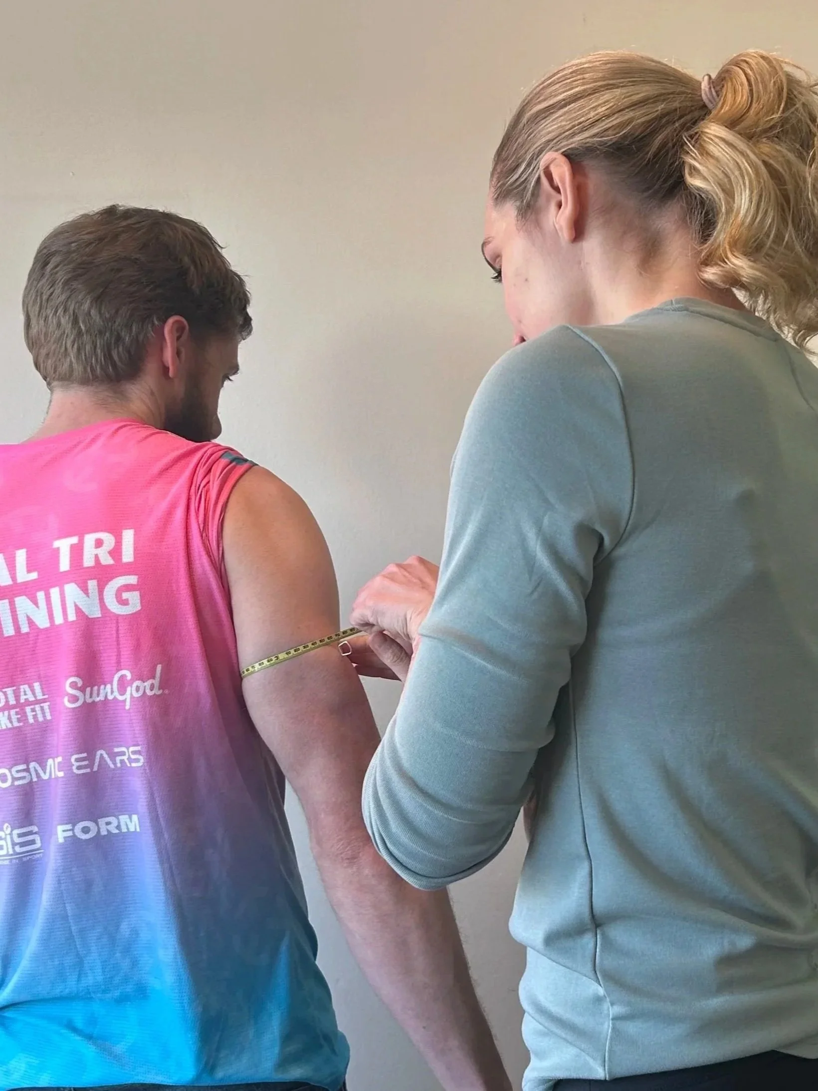 Dietician assessing body composition of an athlete