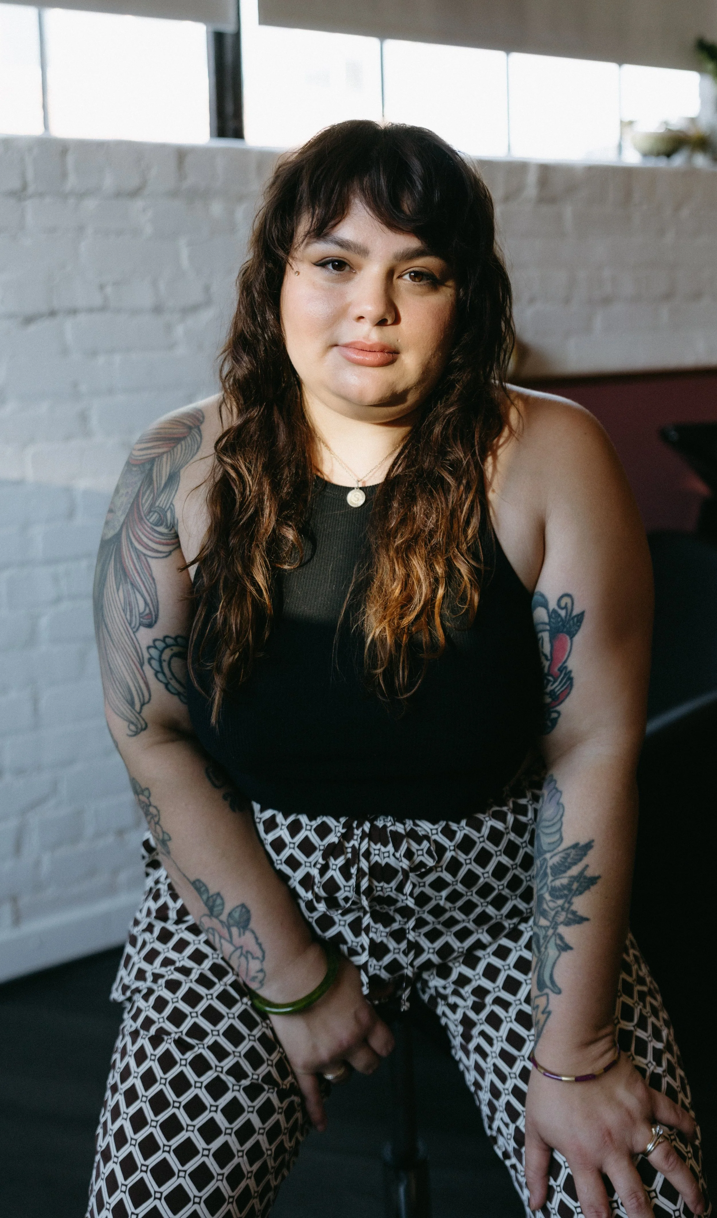 Lifestyle portrait of Sara Parker, a Richmond VA stylist who specializes in curly hair.