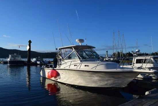 Bluefin Fishing Charters' boat, a Pursuit 27, moored at Jocks Dock in Sooke, BC.