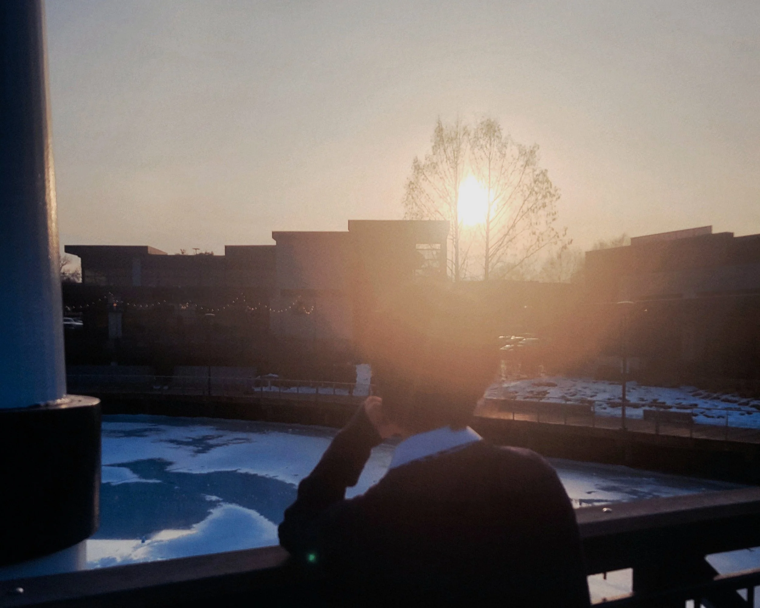 Lucas Hahn stands at the edge of a harbor.