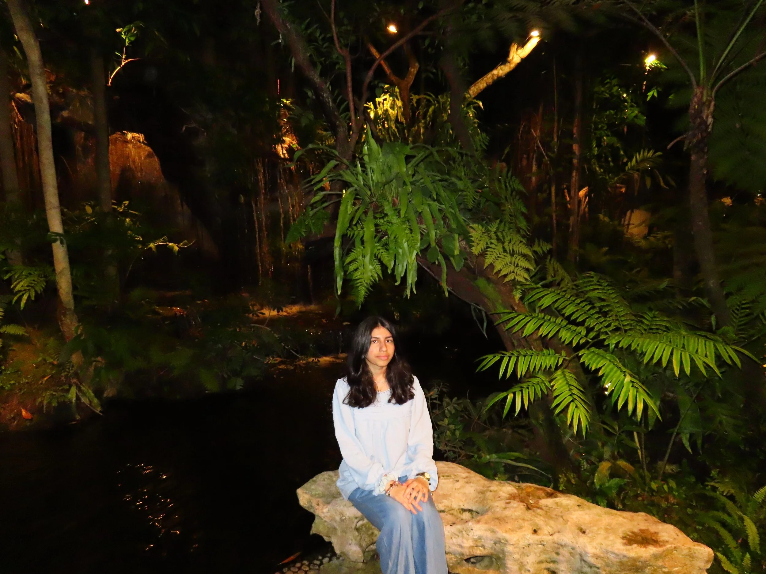Fatima poses near a creek.