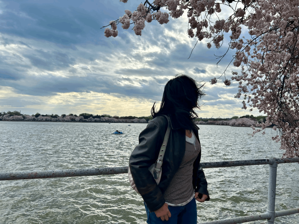 Mika Hu stands by the water.