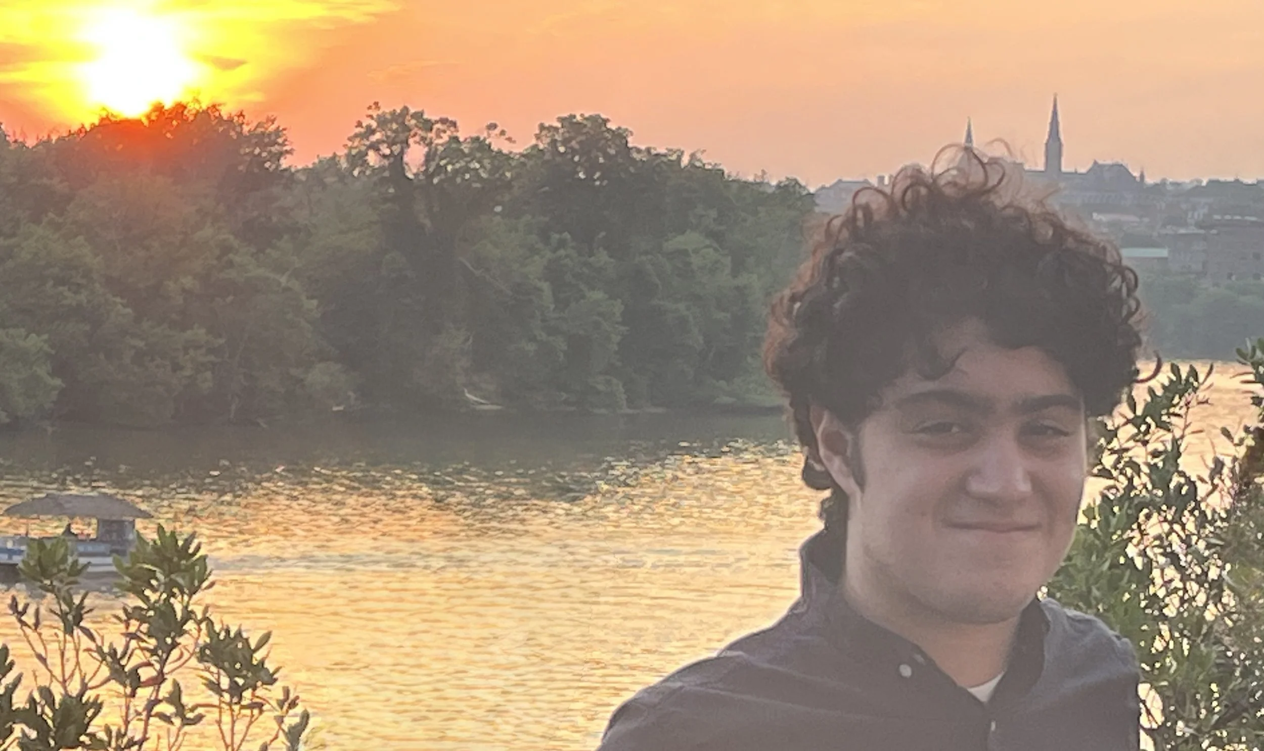 Alessandro Lisa stands near water.