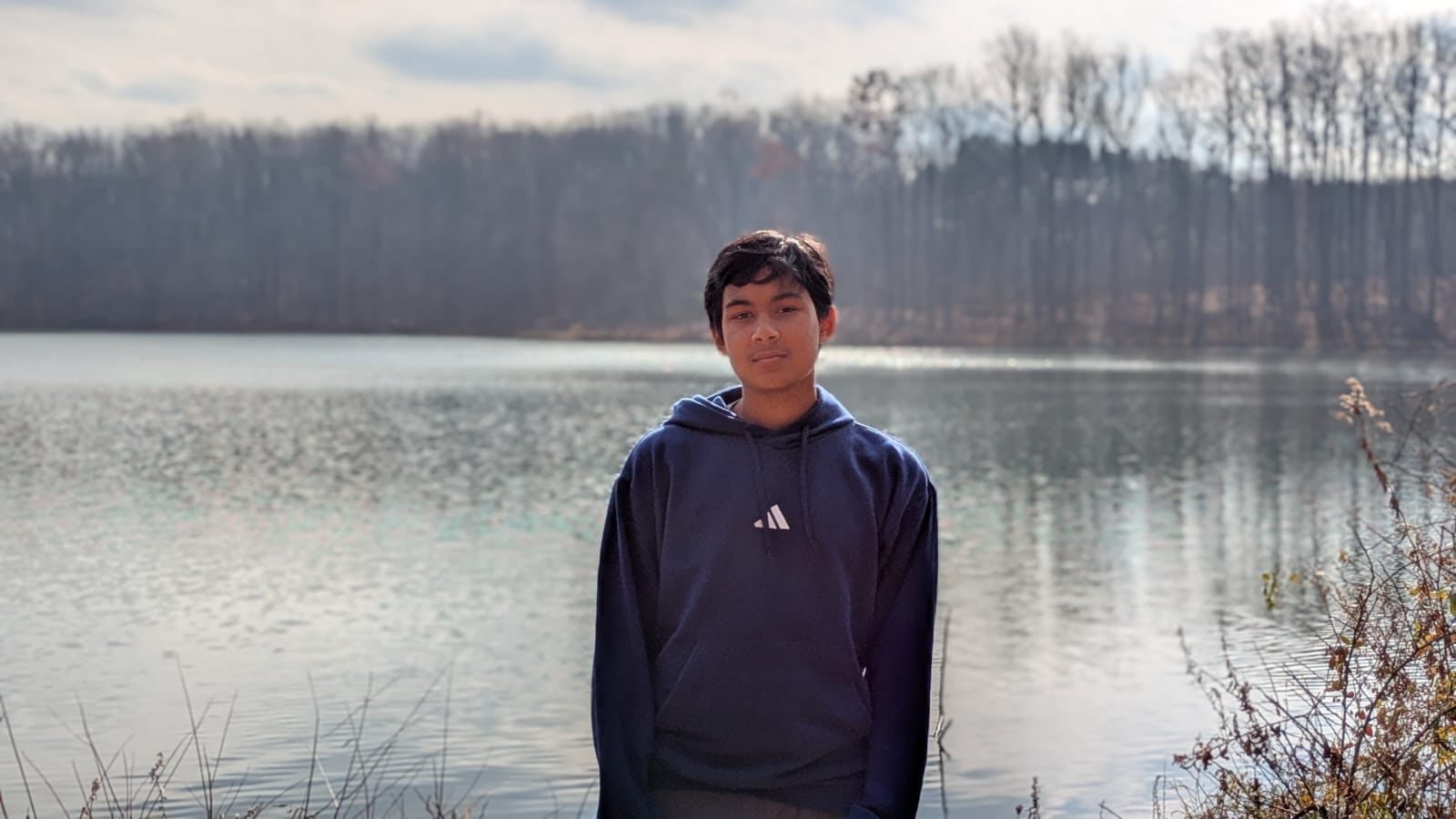 Aarav Bhandari poses at a lake.