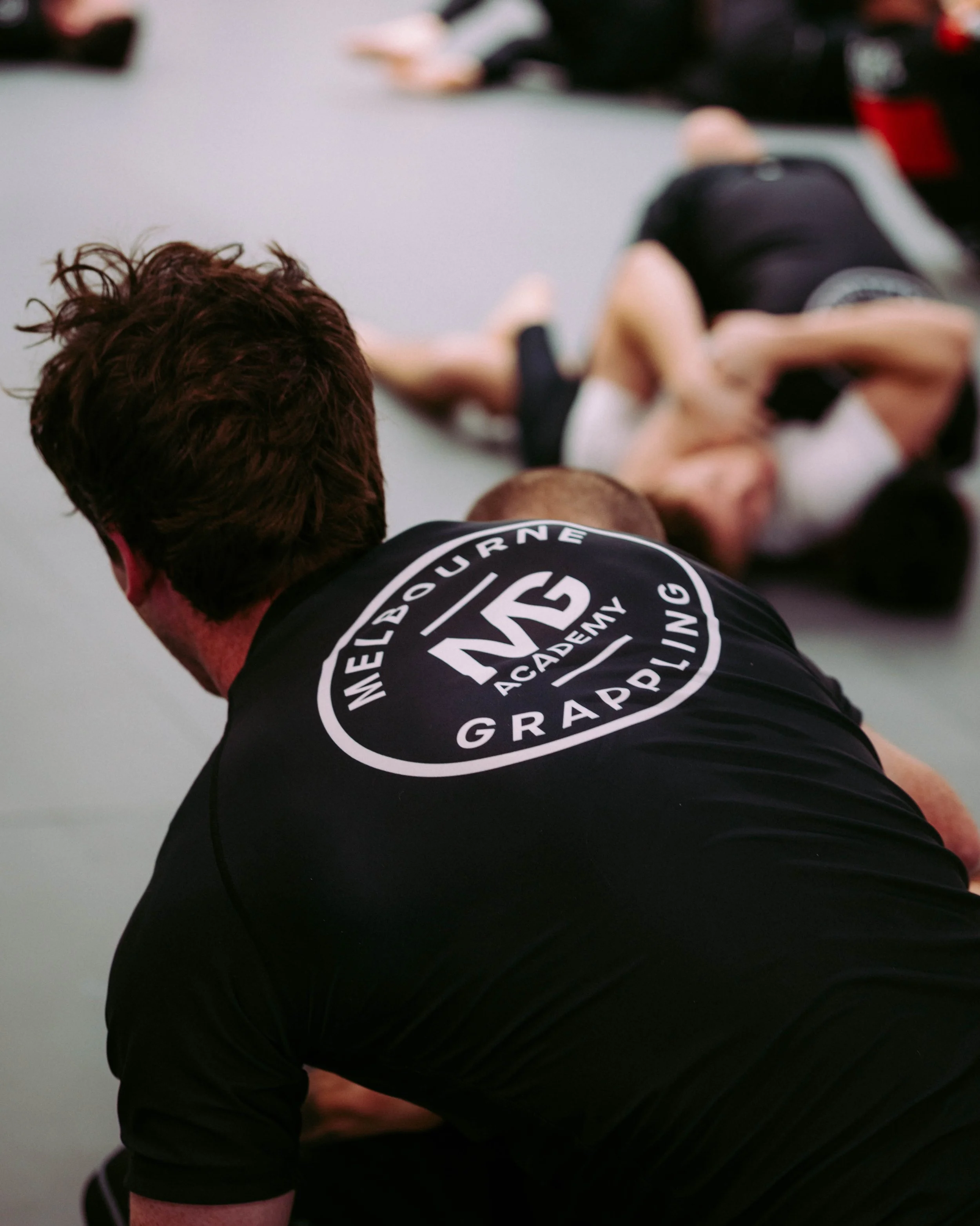 BJJ sparring at Melbourne Grappling Academy, Moorabbin - back take during a training session.
