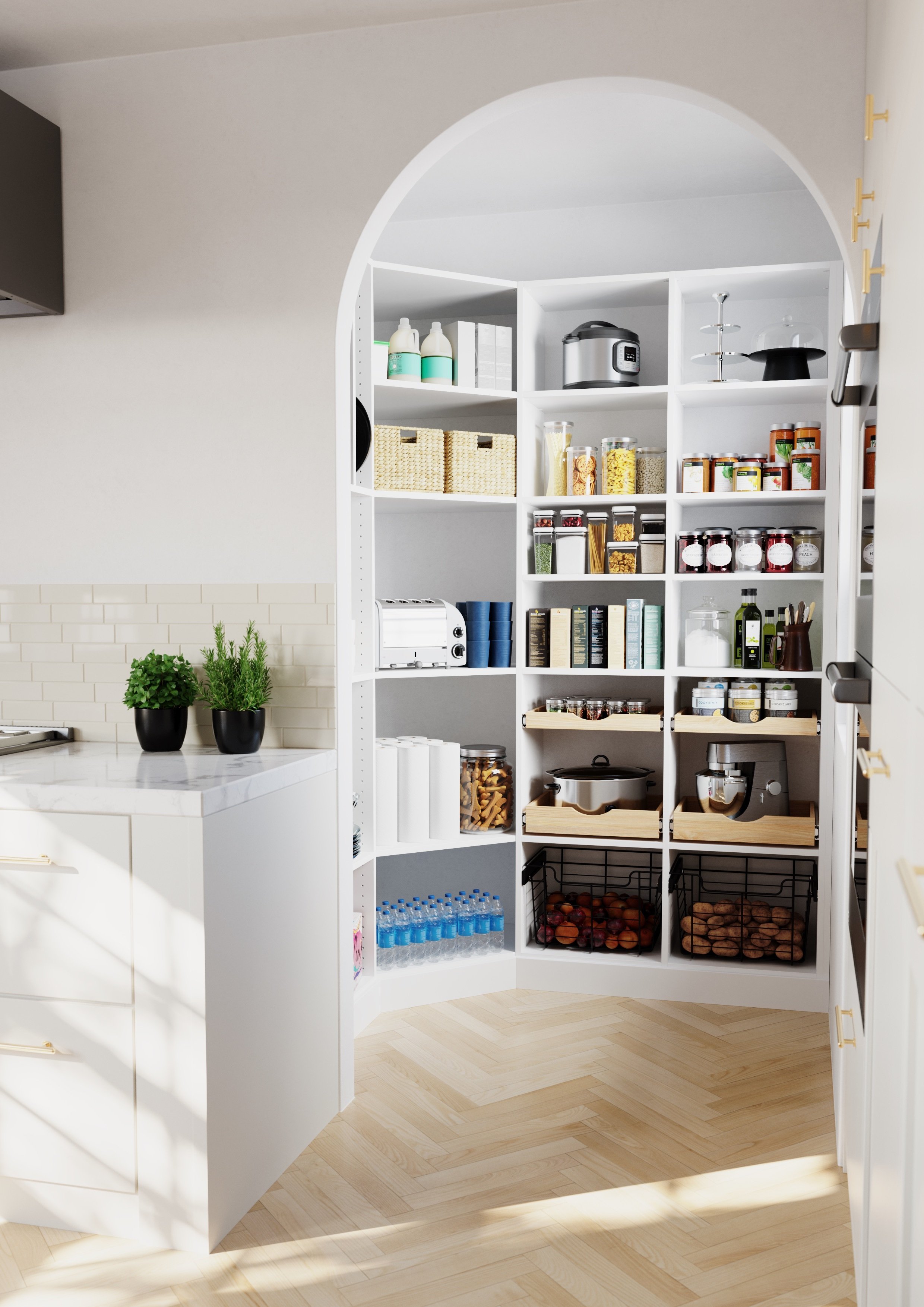 Pantry with white shelves filled with jars, boxes, and appliances, alongside potted herbs on a white countertop, and a light wood floor.