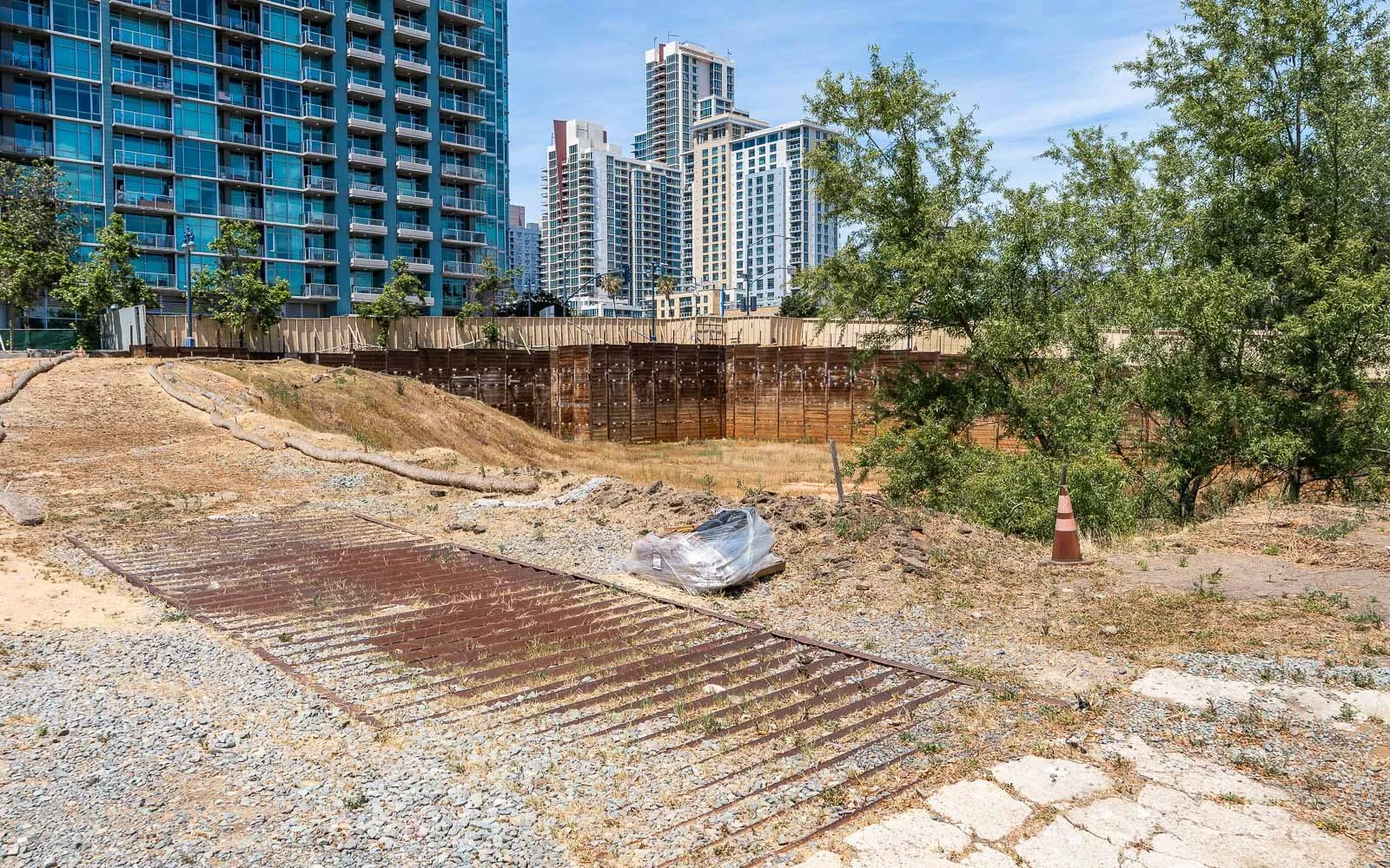 A fault line halted plans for a 40-story tower. Years later, the site remains a ‘hole in the ground’
