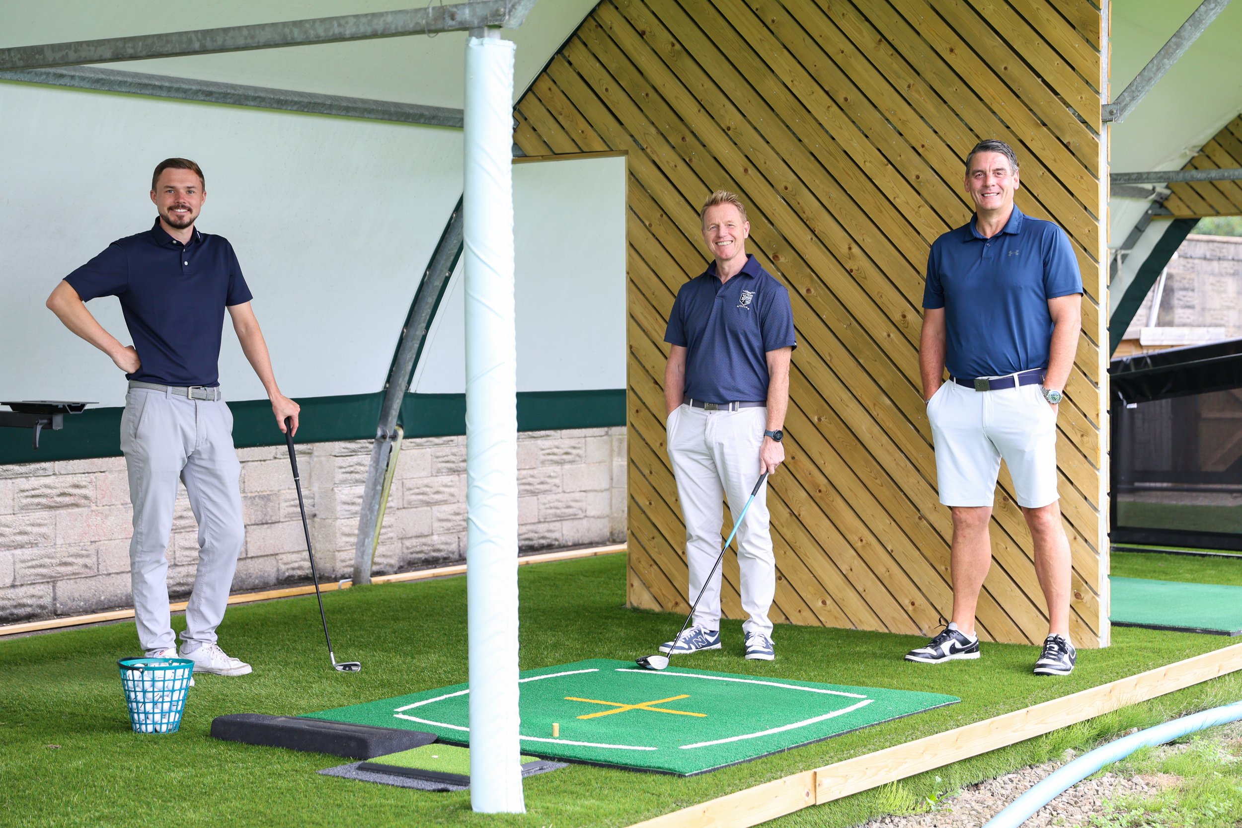 Our dedicated team of experienced PGA Professionals at one of the bays at Gowerton Golf Range. From left to right, Llewellyn Miller, Mike Hobbs and Gethin Collins.