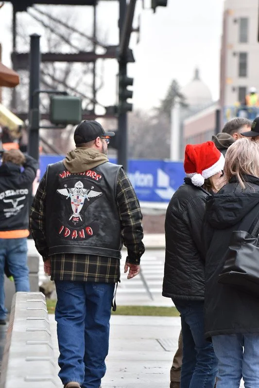 A full patch IWMC member walks away from the camera during the toy drive.