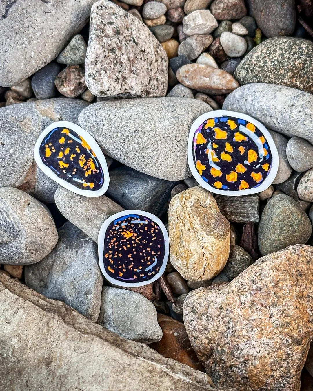 Some rocks are cool. Some rocks GLOW. 🔦🪨

The Yooperlite Sticker Pack is for everyone who has ever wandered a Lake Superior beach after dark with a UV flashlight like a completely normal person. 😂

A whole little collection inspired by one of Mich