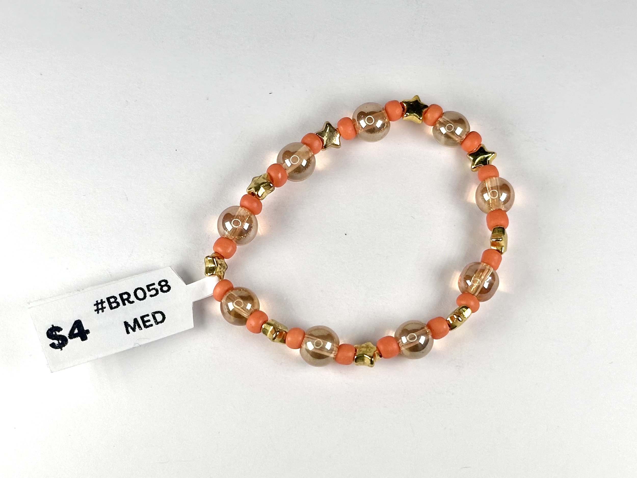 Medium Clear, Orange & Gold Star Beaded Stretch Bracelet | Glass & Acrylic Beaded Bracelet