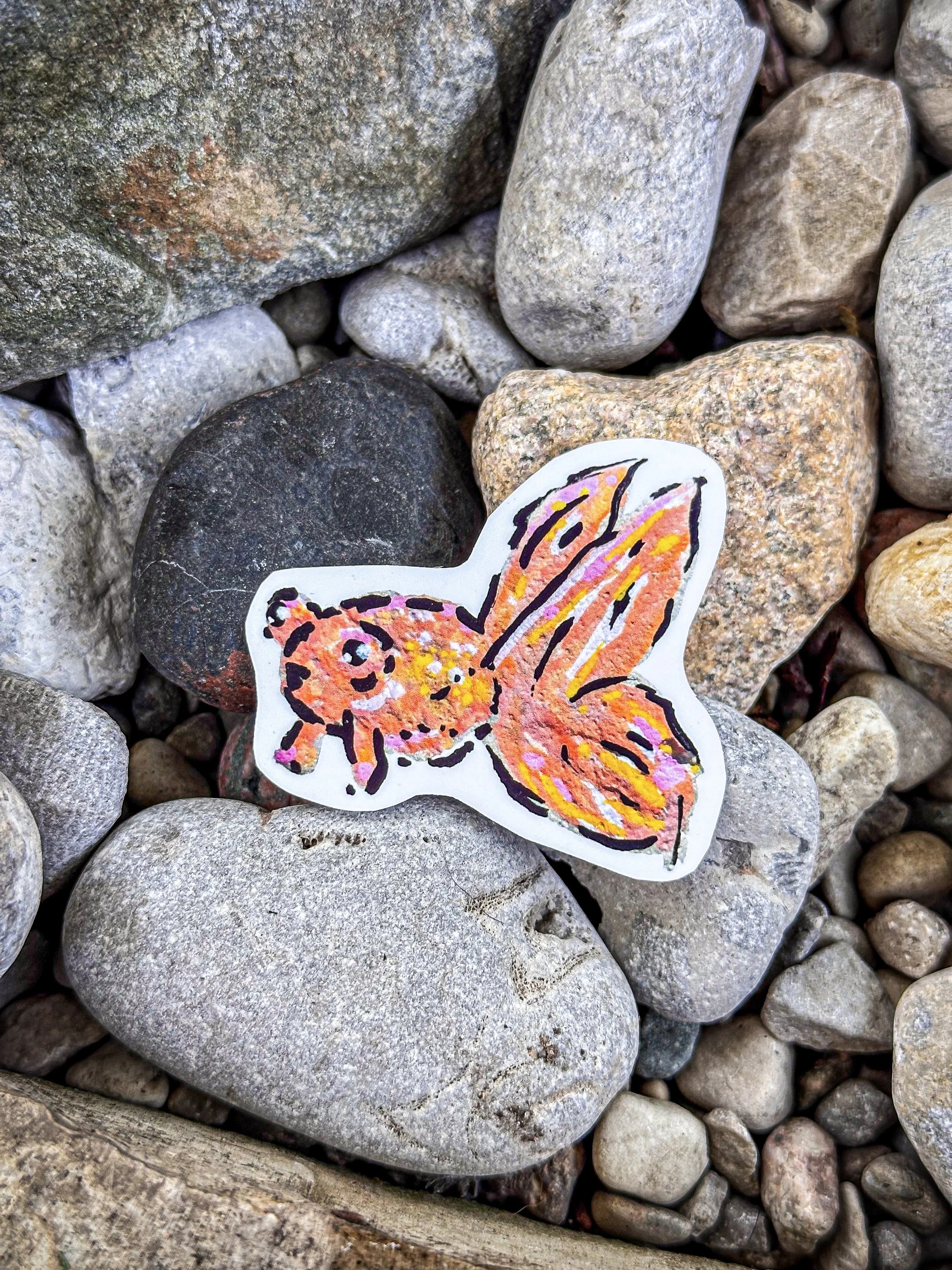 Orange and pink goldfish sticker created from an original hand-painted rock by The Inky Koi Studio