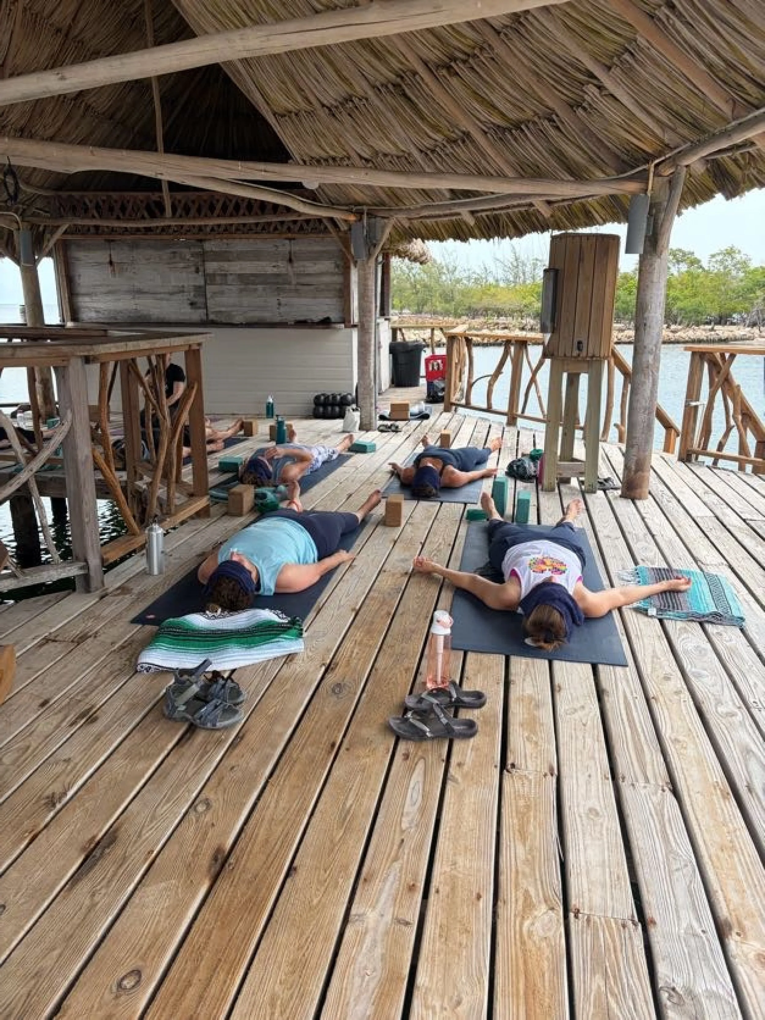 People relaxing in savasana