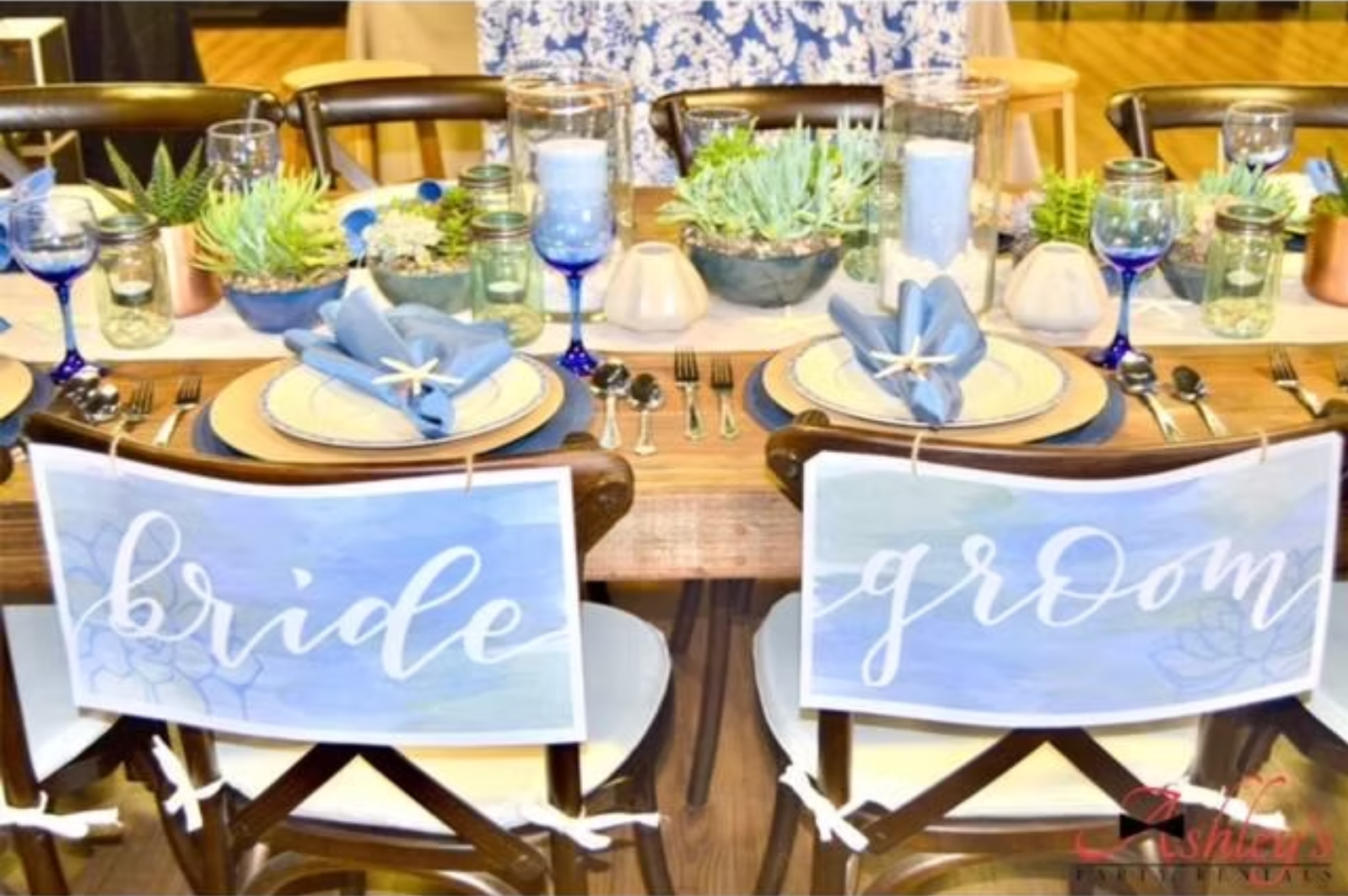 Bride and Groom setting at a dressed table.png