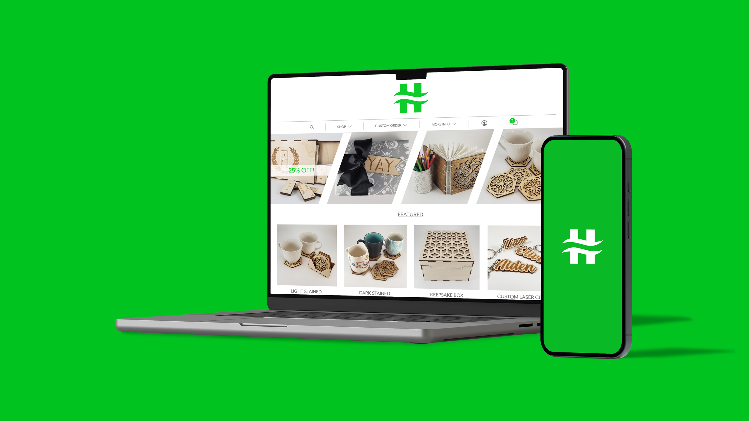 A laptop and smartphone a green background displaying an e-commerce website that sells laser-cut products.