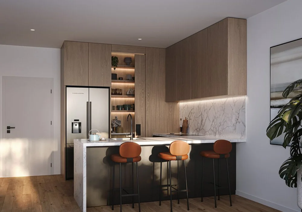 Modern kitchen with wood cabinetry, marble backsplash, stainless steel refrigerator, and three orange barstools at a white marble island.