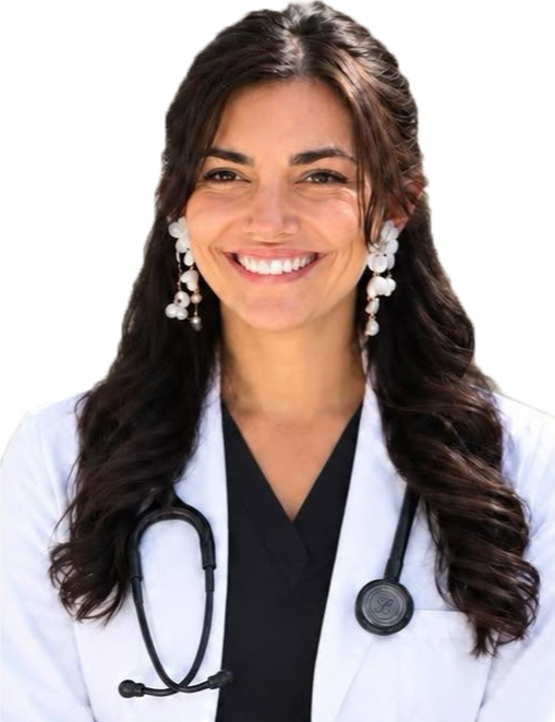 A smiling female doctor with long dark hair, white coat, and stethoscope, wearing white earrings.