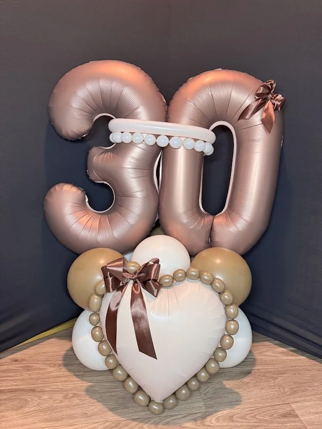 Mono-chrome double number balloon stack with soft chocolate and cream colored balloons. Chocolate number 30 and cream foil heart with mocha pearls on outline. Pull it all together with a few brown satin bows. 