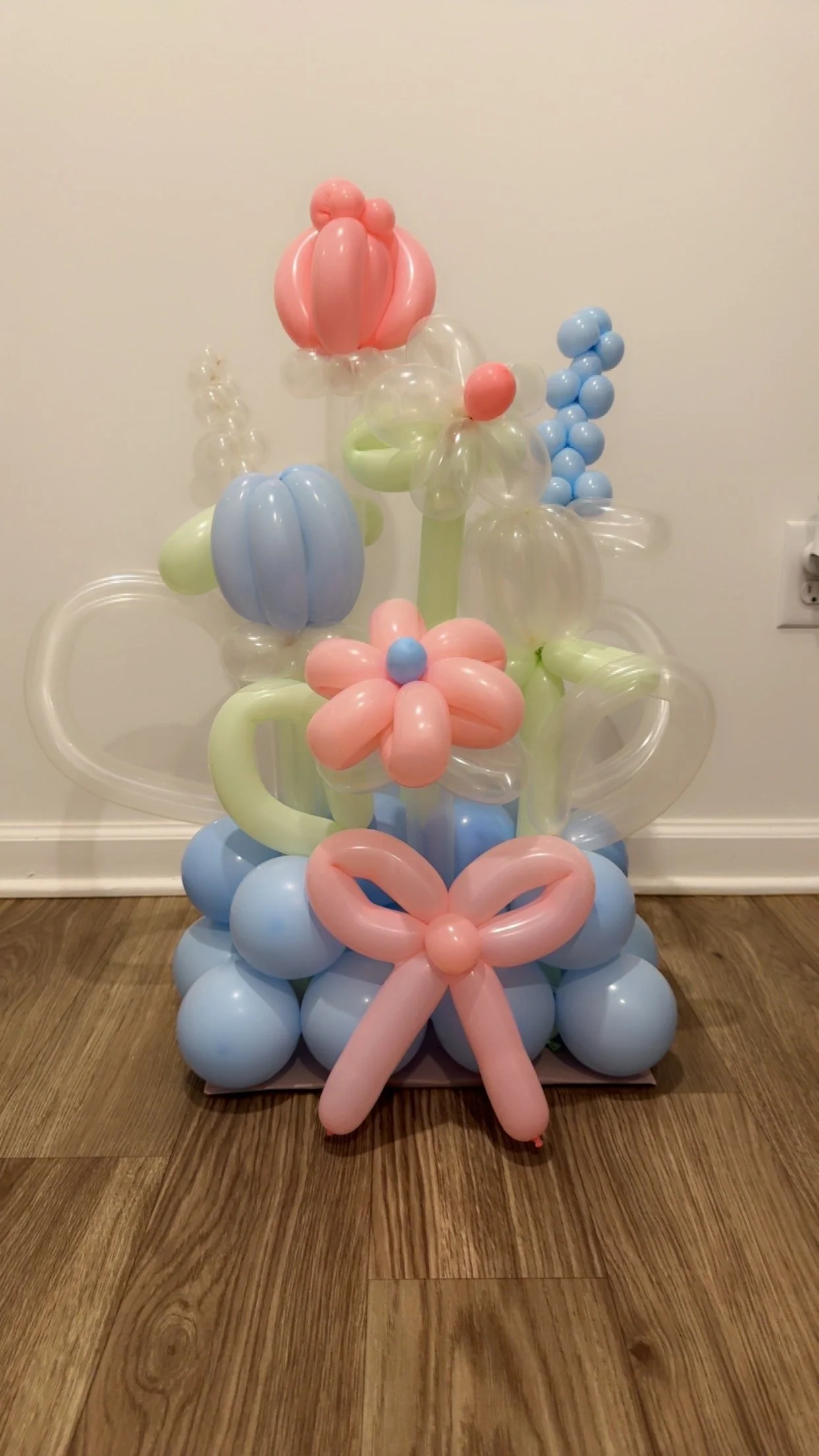 Balloon Garden with light blue balloon base, flower stems with pink, blue and clear flowers.