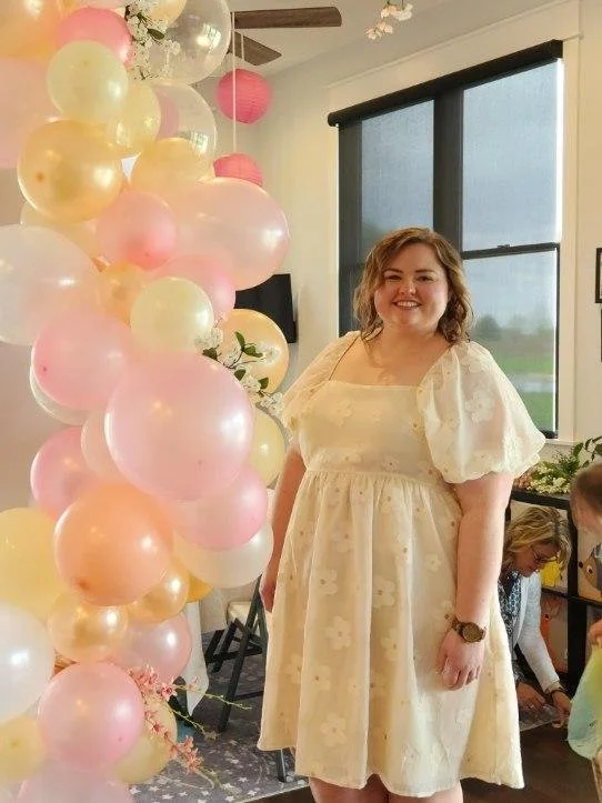 Bridal shower balloon garland with pink, blush and white balloons.