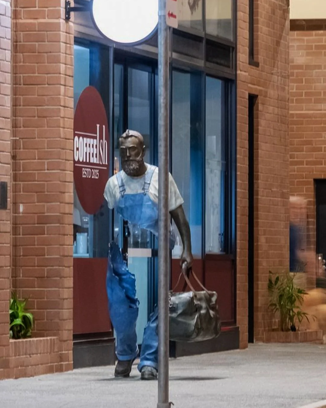 You could walk past it, but once you notice it, you'll stop. Raphael, the Traveller has a way of catching you mid-thought on Fish Lane.

Raphael the Traveler, 2024' by Bruno Catalano