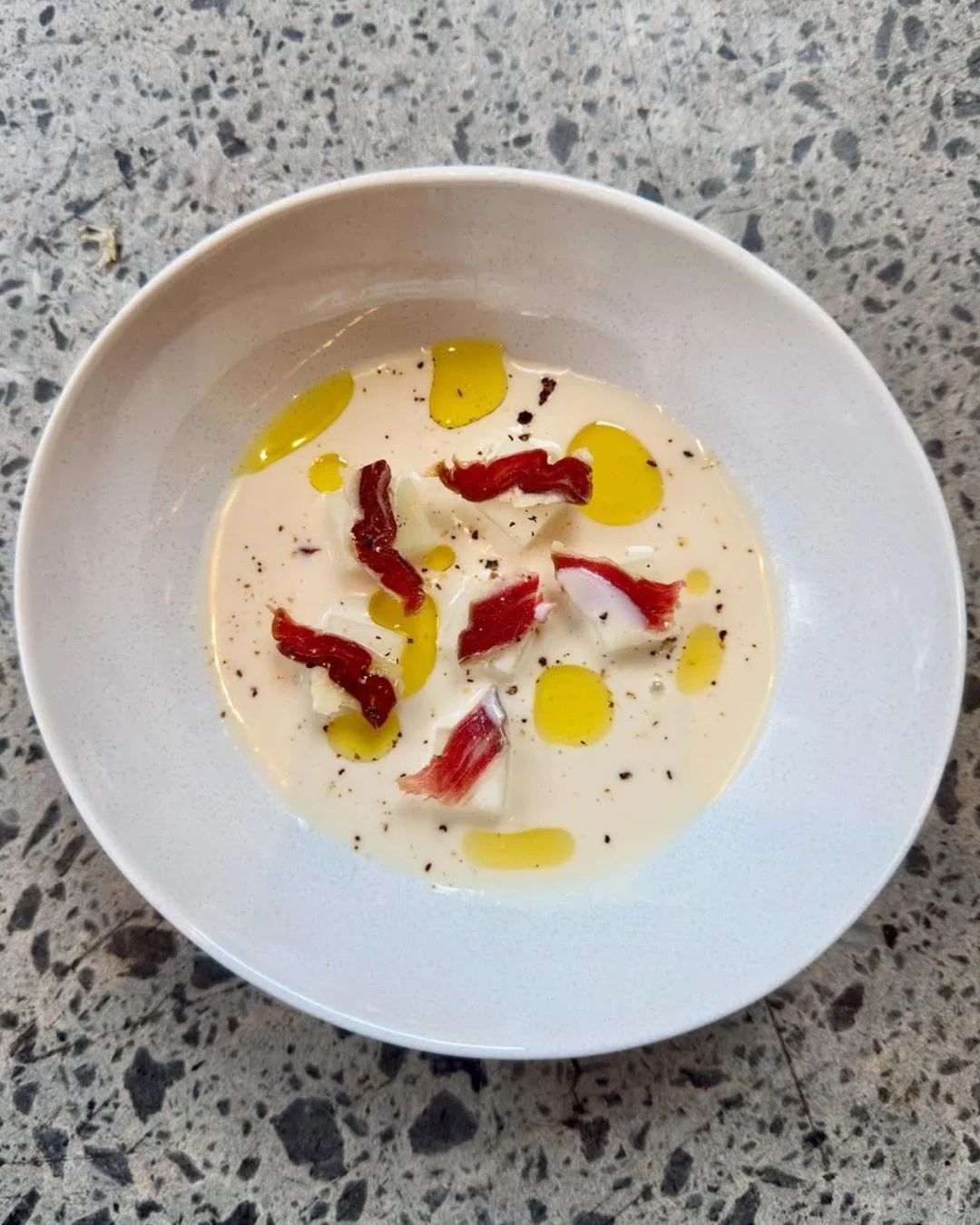 The masters of flavour are right here on Fish Lane. 🤤 Clarence brings together ajoblanco, Jam&oacute;n Ib&eacute;rico and piel de sapo melon in a dish that balances richness, freshness and just the right amount of indulgence.