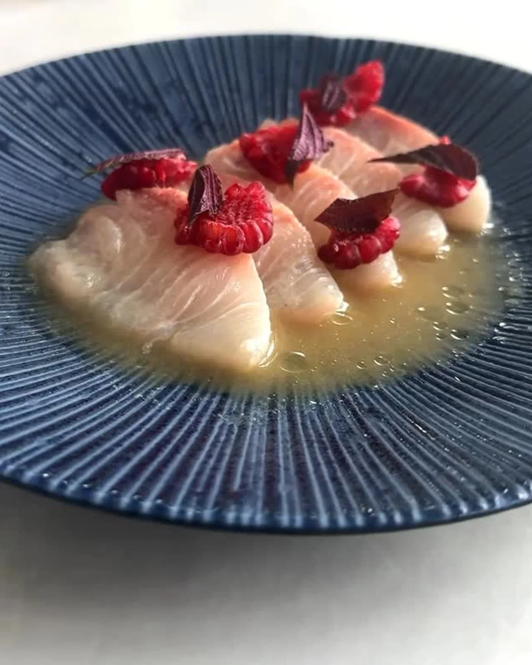 Fish Lane is looking very good from this angle. Yellowtail kingfish dressed in white soy and ginger, finished with raspberries and shiso, a Clarence dish that proves flavour and presentation go hand in hand.
