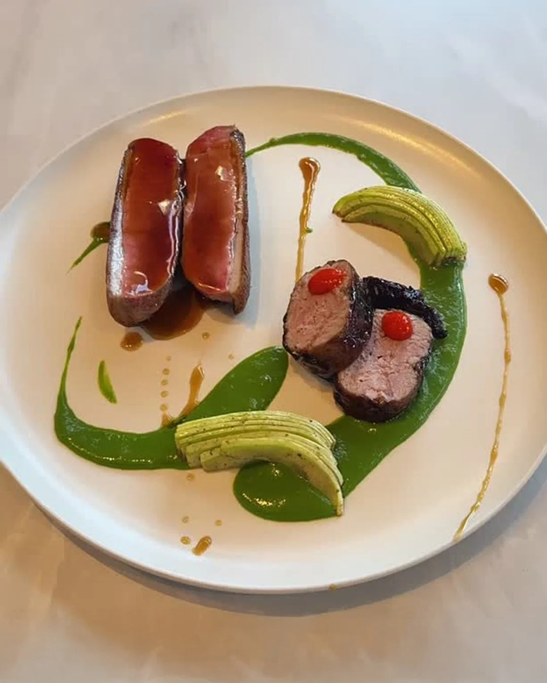 Aged duck breast with cherry and aonori condiment, Ronde de Nice zucchini, tsukune from the leg meat and blood orange kosho. One look at this plate from Clarence, and dinner plans start making themselves.