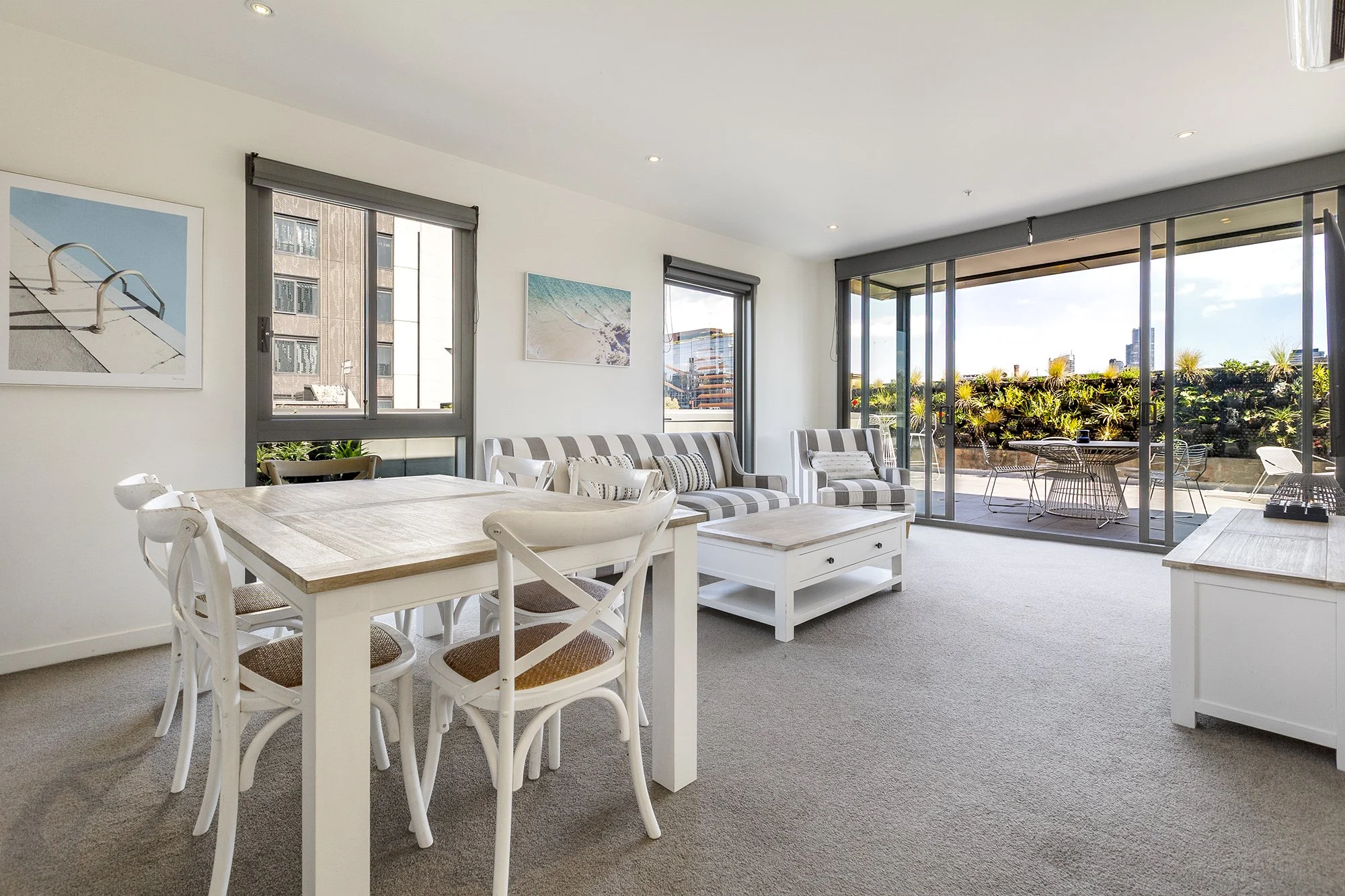 Open-plan living and dining area in a Richmond Airbnb with terrace access