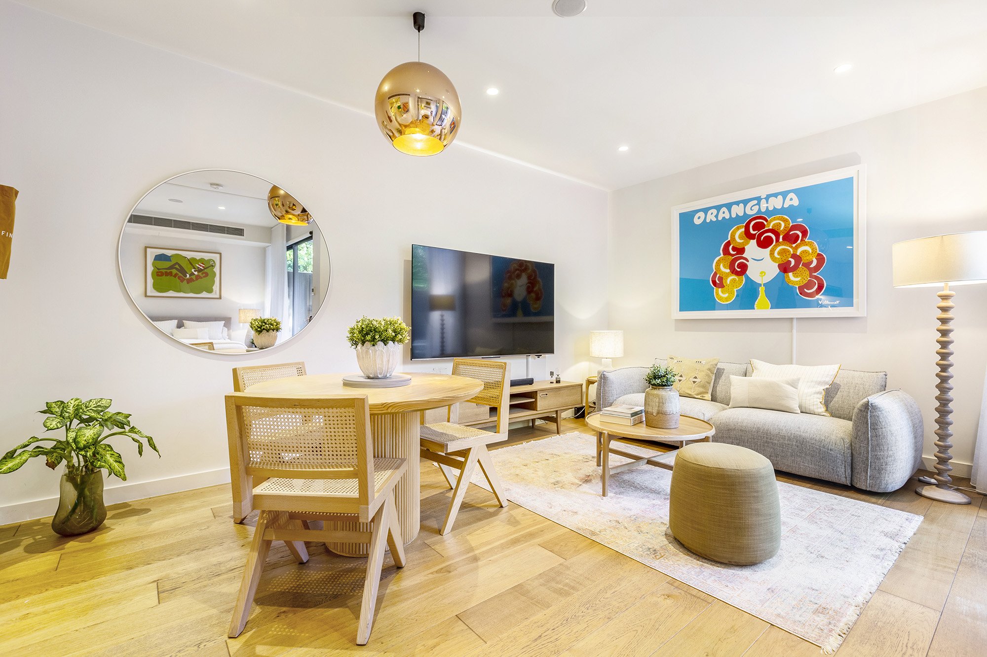 Interior professional photography of a Glen Iris Airbnb apartment, showing Scandi style furniture and a brightly lit lounge room.