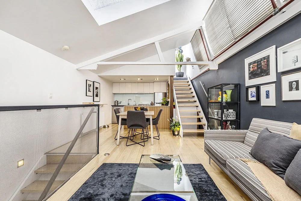 Airbnb photography Melbourne. interior of a three story townhouse in Richmond with angled ceilings and skylights.