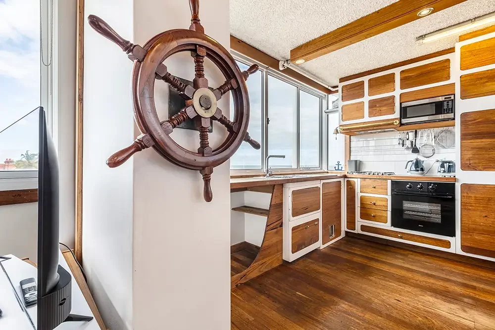 Unique nautical-themed kitchen in St Kilda, expertly photographed to highlight property character and layout.
