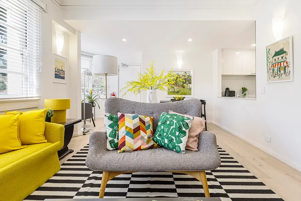 Professional Airbnb photography of a sun-drenched South Melbourne property, highlighting open-plan layout and natural light.