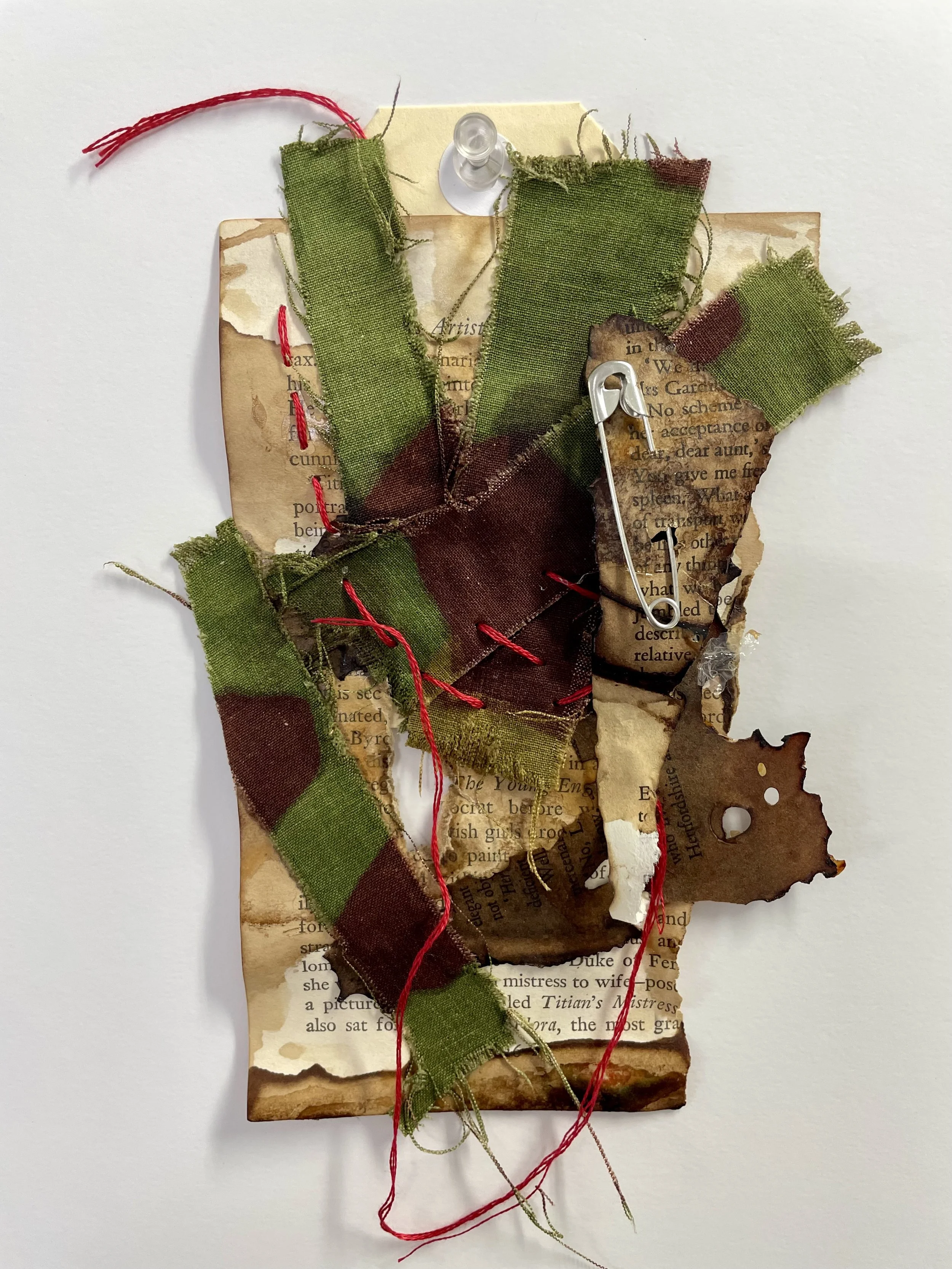 Red Thread. BRONNY. 2026. Layered textiles, paper, thread, found objects. 23 × 11cm, unframed